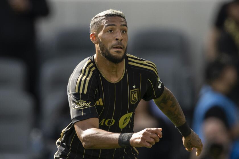 Los Angeles FC forward Denis Bouanga (99) runs during an MLS soccer match.