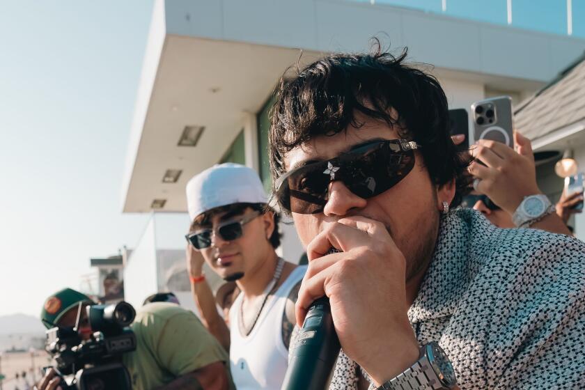 Fuerza Regida frontman Jesús Ortiz Paz performs during a listening party in Santa Monica on July 25, 2024