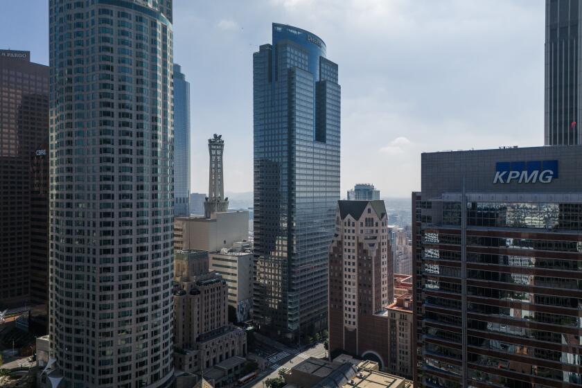 LOS ANGELES, CA- MARCH 28: The Gas Company Tower (center) in downtown, Los Angeles, CA, is facing foreclosure a year after the owner, an affiliate of Brookfield Asset Management Ltd., walked away from the building. A notice of trustee's sale for the building was filed March 21 with the Los Angeles County Recorder's office, setting the stage for a foreclosure sale as soon as 90 days after the filing. Photographed on Thursday, March 28, 2024. (Myung J. Chun / Los Angeles Times)