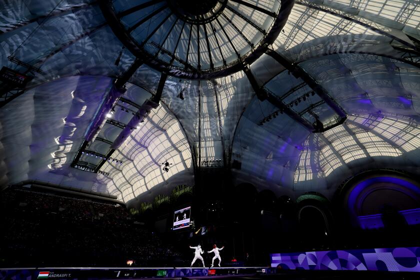 PARIS, FRANCE July 28, 2024-USA battles for gold and silver medals in the epee at the 2024 Olympics in Paris, France Sunday(Wally Skalij/Los Angeles Times)