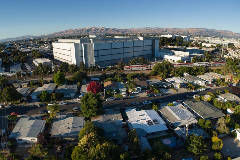 SANTA CLARA CA JULY 30, 2024 -- A neighborhood near a large data center on Tuesday, July 30, 2024 in Santa Clara, Calif. Dozens of data centers being built for artificial intelligence are eating up Calfifornia's electricity. There are 50 data centers in the city of Santa Clara. The massive buildings now use up 60% of the power from the municipal utility called Silicon Valley Power. (Paul Kuroda / For The Times)