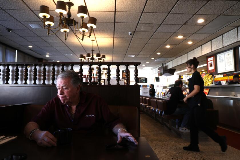 LOS ANGELES, CA - AUGUST 14, 2024 - Norm Langer, 79, president and chief executive of Langer's Delicatessen-Restaurant, discusses changes to his neighborhood near MacArthur Park and is considering closing the business in Los Angeles on August 14, 2024. Langer has seen it all as a merchant in the MacArthur Park area and he's upset with multiple festering public safety issues, including how the city wants to close Wilshire to auto traffic, which doesn't help with the major needs of the community in his opinion. (Genaro Molina/Los Angeles Times)