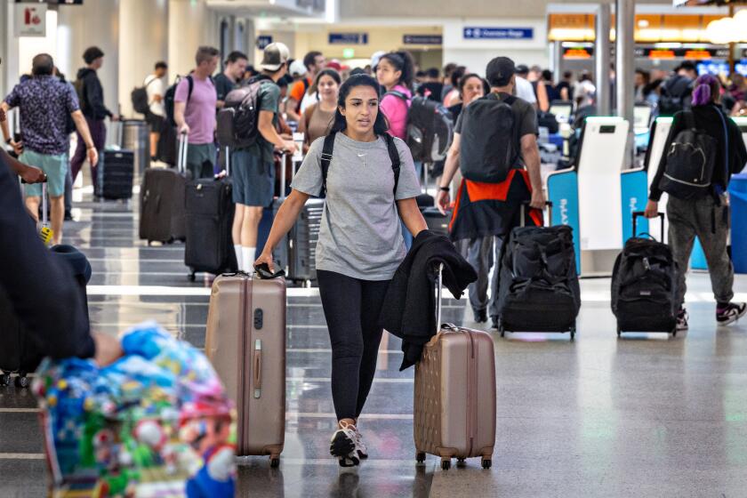 Los Angeles, CA - July 07: A large number of travelers make their way through Tom Bradley International Terminal at LAX, as a record amount of passengers pass through the airport today wrapping up a busy July 4th holiday on Sunday, July 7, 2024 in Los Angeles, CA. (Jason Armond / Los Angeles Times)