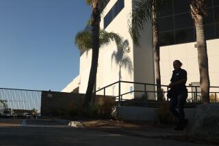 Inglewood, CA - August 15: A worker walks by Flying Food Group on Thursday, Aug. 15, 2024 in Inglewood, CA. (Michael Blackshire / Los Angeles Times)