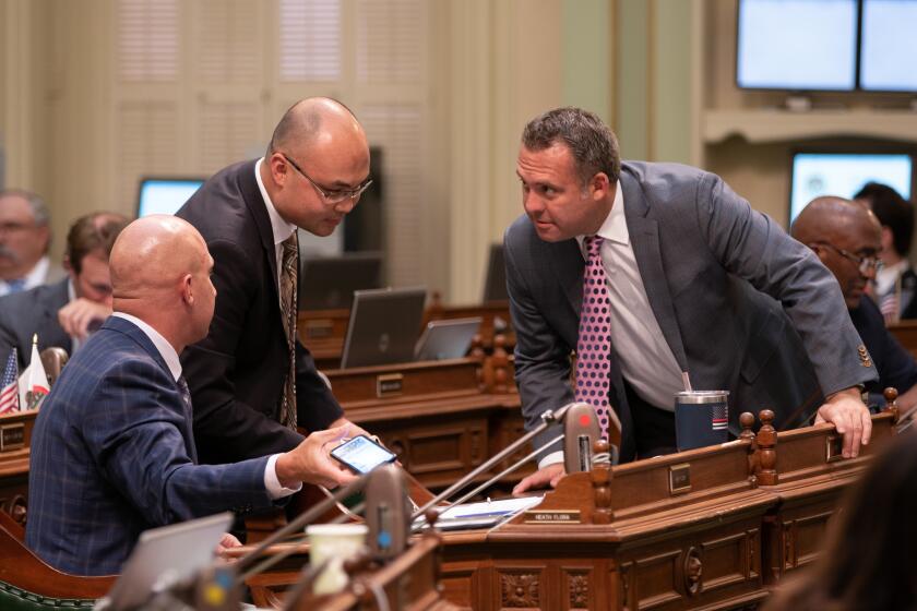 SACRAMENTO CA SEPTEMBER 9, 2019 -- Assemblyman Adam Gray (D-Merced), right, meets with Assemblyman Tyler Diep (R-Westminster), center, and Assemblyman Heath Flora (R-Ripon) at the state Capitol on Aug. 29, 2019. (Robert Gourley / Los Angeles Times)