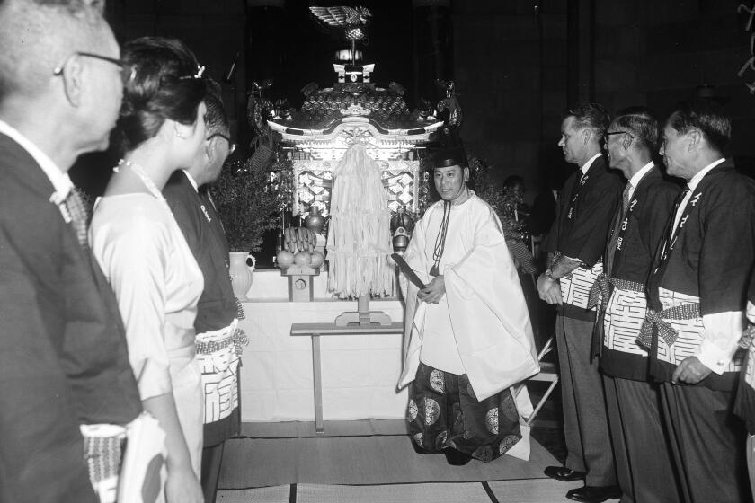 Nisei Week, August 18 1960. 'Mikoshi' presented to Los Angeles;Dito Tsuyuki (Shinto priest);Yukio Hasumi (Japanese Consul General);Akemi Tani (Nisei Week Queen);Edward Roybal (Councilman).;Caption slip reads: 'Photographer: Mitchell. Date: 1960-08-18. Reporter: Reay. Assignment: 'Mikoshi' presented to City of L.A it is a Shinto. L to r., 5/6: Japanese Consul Gen. Yukio Hasumi;Misei Week Queen Akemi Tani;Councilman Edward R Roybal. 57/58: Shinto priest Dito Tsuyuki dedicating shrine'.Los Angeles, California. (Photo by Los Angeles Examiner/USC Libraries/Corbis via Getty Images)