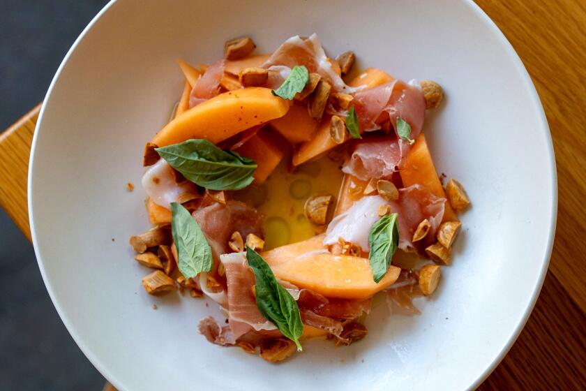 Weiser Family Farm Melon and Prosciutto Cured speck, melon vinaigrette, basil and Aleppo spiced marcona almonds.